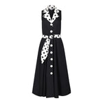 Ghost image, front view of black fit and flare polka dot midi dress.  Collar and belt is white with black polka dots and main dress is all black with white buttons on centre front. 